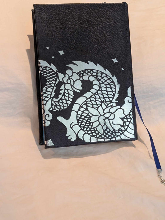 The Booktok Book Seraphina of some rebound with book binding with custom covers. Made with Leather and Vinyl right here in Canada!