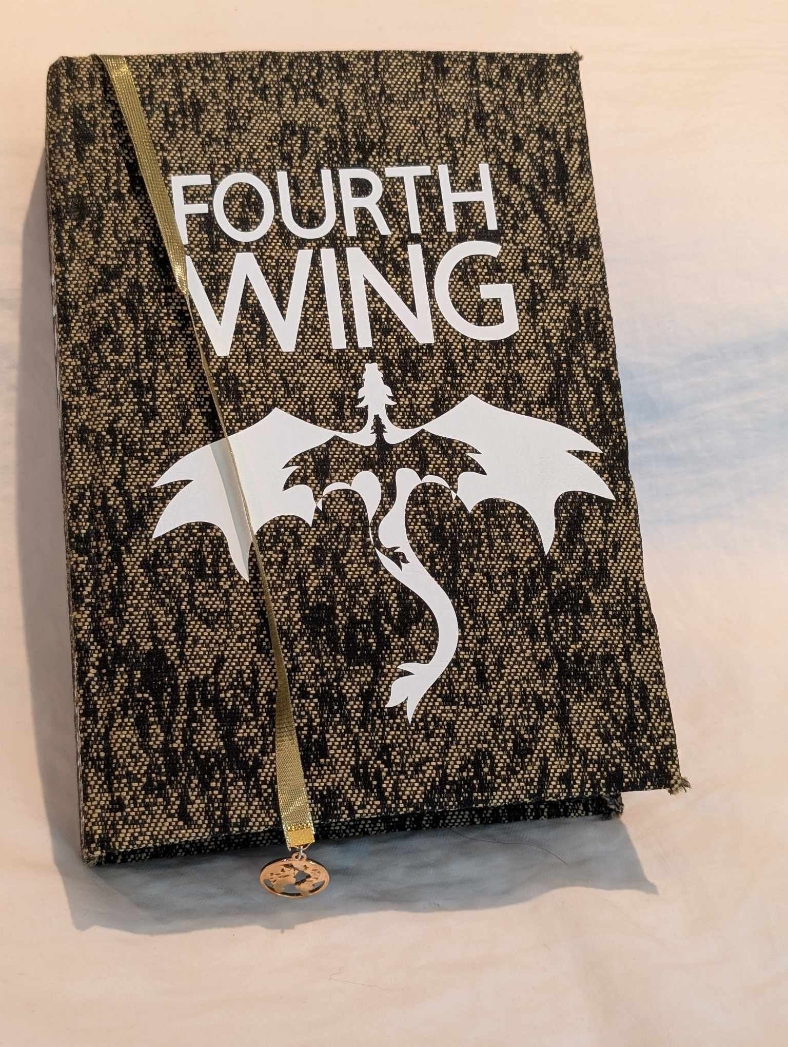 The Booktok Book sensation Fourth Wing  rebound with book binding with custom covers. Made with Leather and Vinyl right here in Canada!