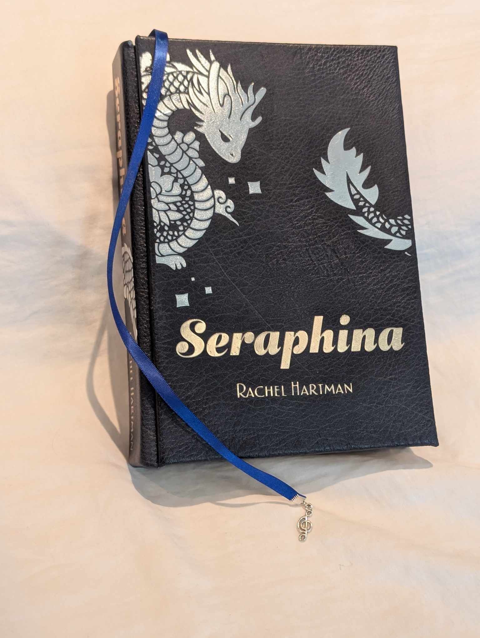 The Booktok Book Seraphina of some  rebound with book binding with custom covers. Made with Leather and Vinyl right here in Canada!