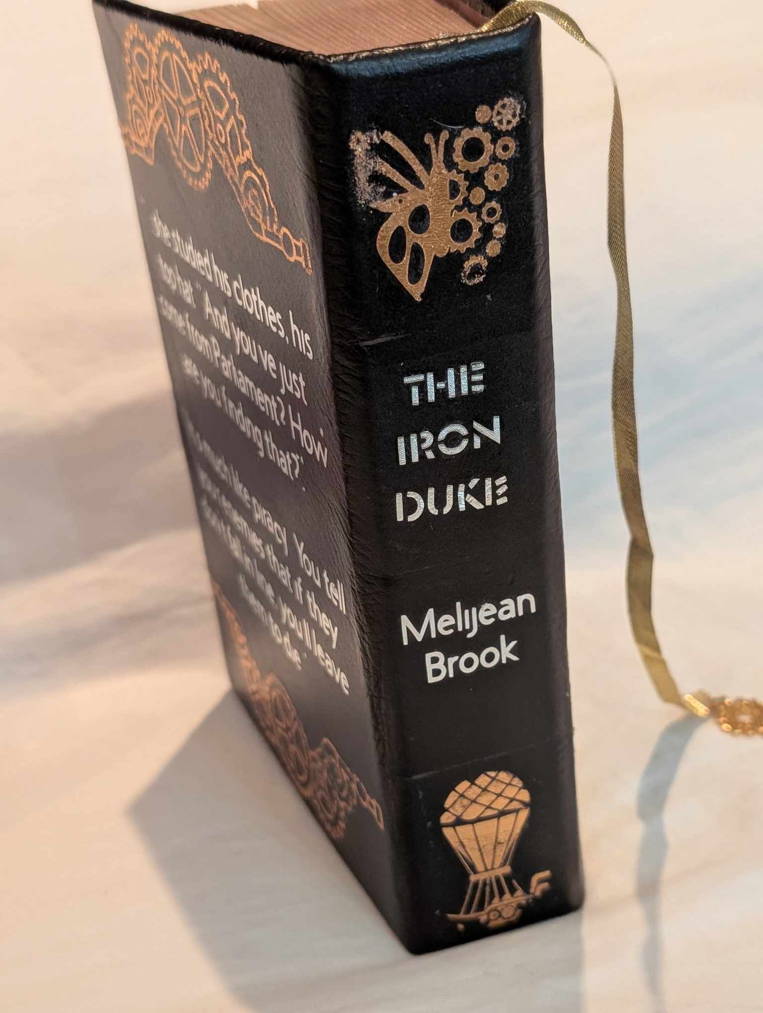 The original Booktok steampunk Book sensation The Iron Duke  rebound with book binding with custom covers. Made with Leather and Vinyl right here in Canada!